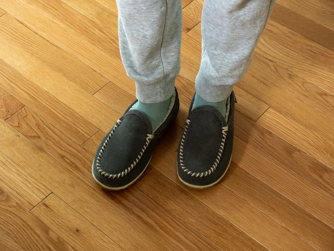 Minnetonka Tilden slippers on feet