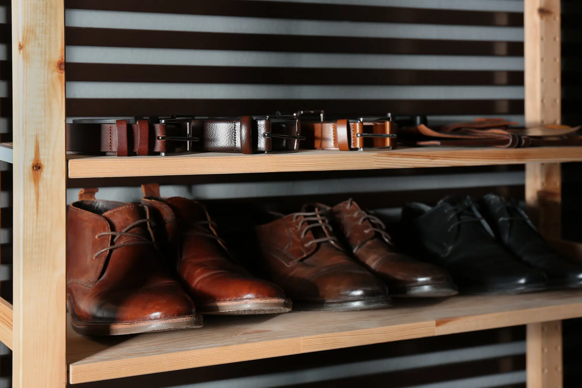 Leather shoes in shelving unit