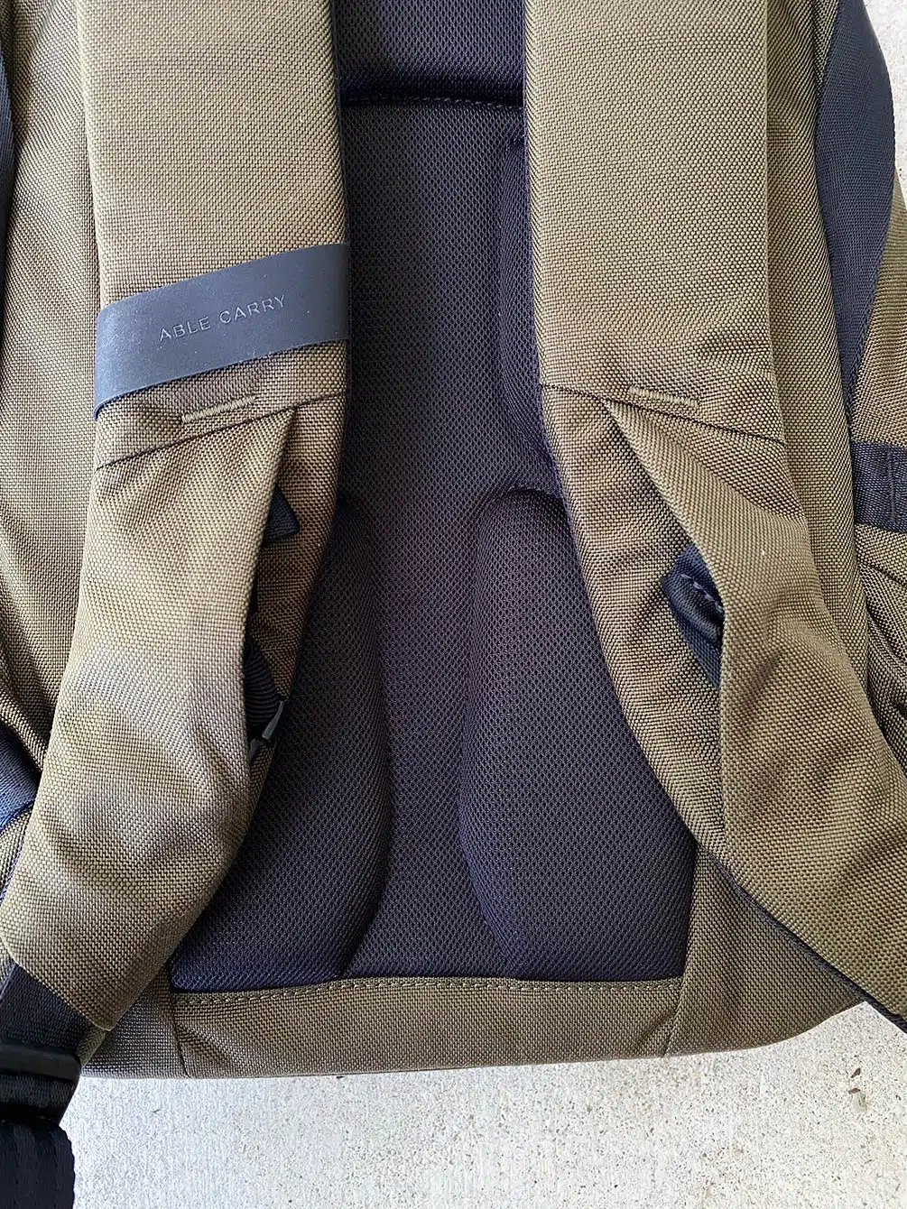 Able Carry Daily Backpack sternum straps tucked in