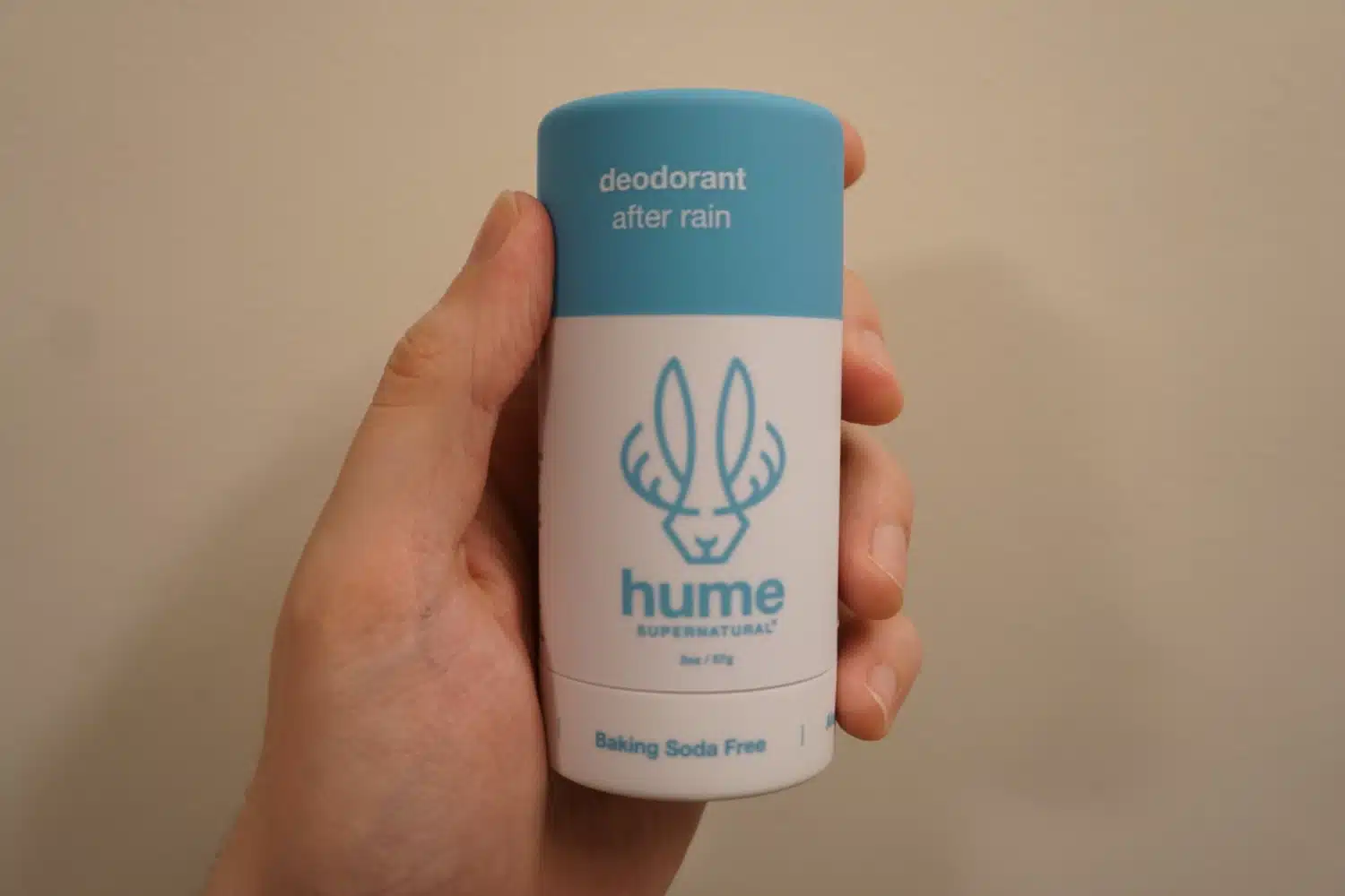 Holding Hume After Rain Deodorant