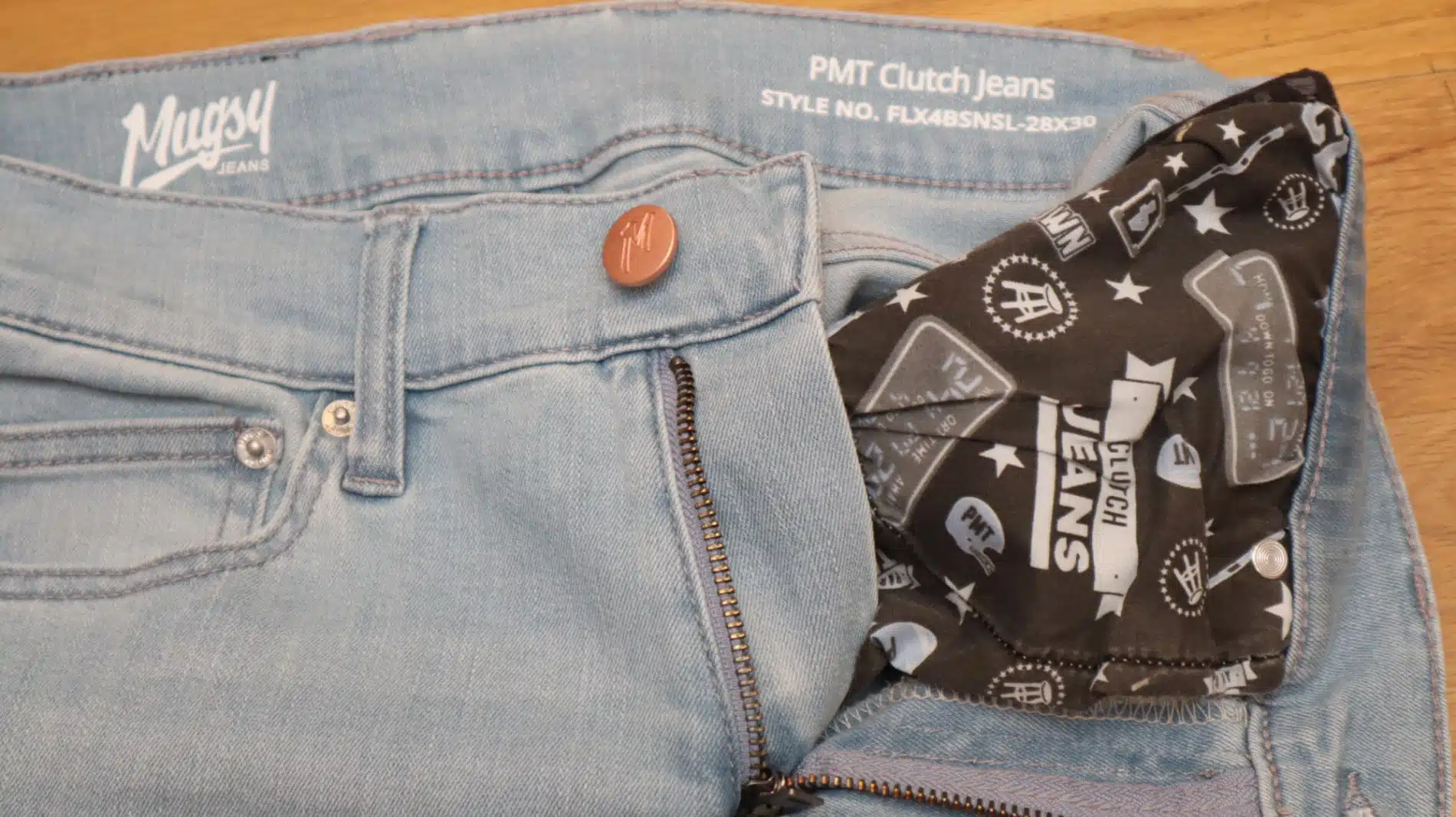 Mugsy Clutch Jeans Button Closeup