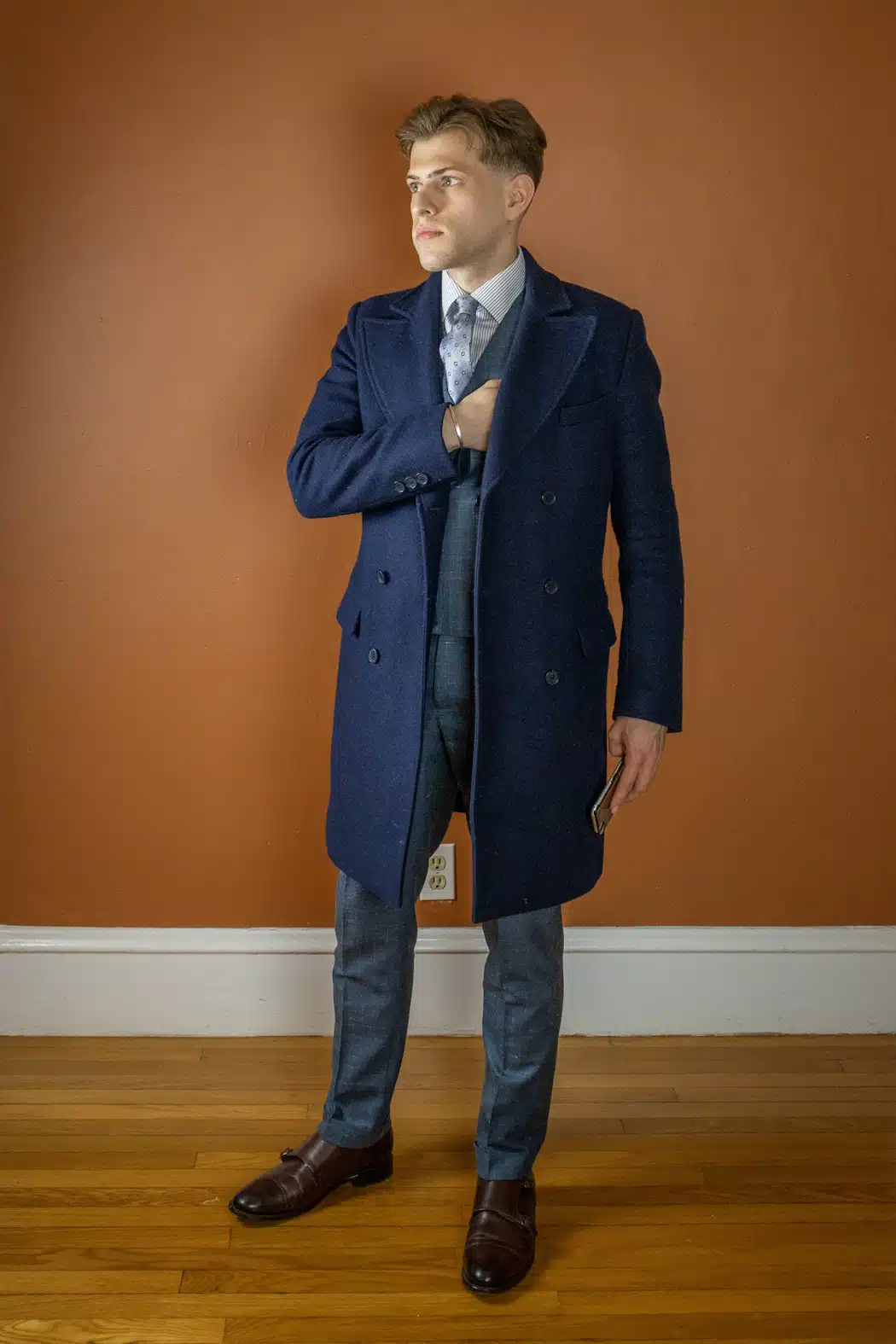 Ryan wearing Thursday boots Saints with a suit and overcoat