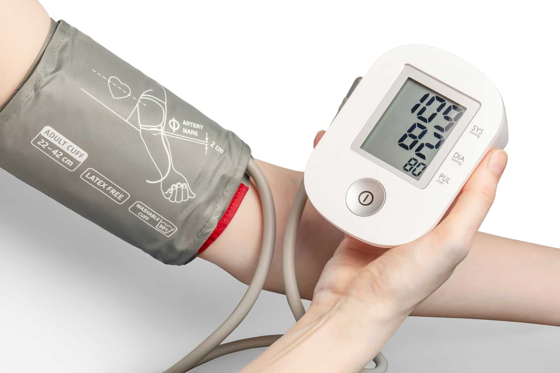 A person measuring blood pressure using a sphygmomanometer.