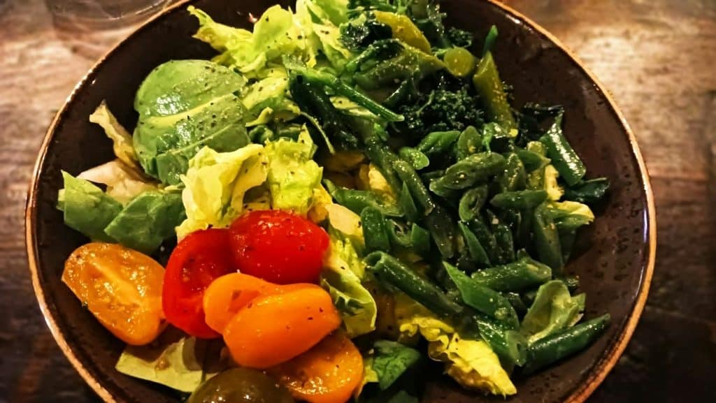 A bowl of vegetable salad.