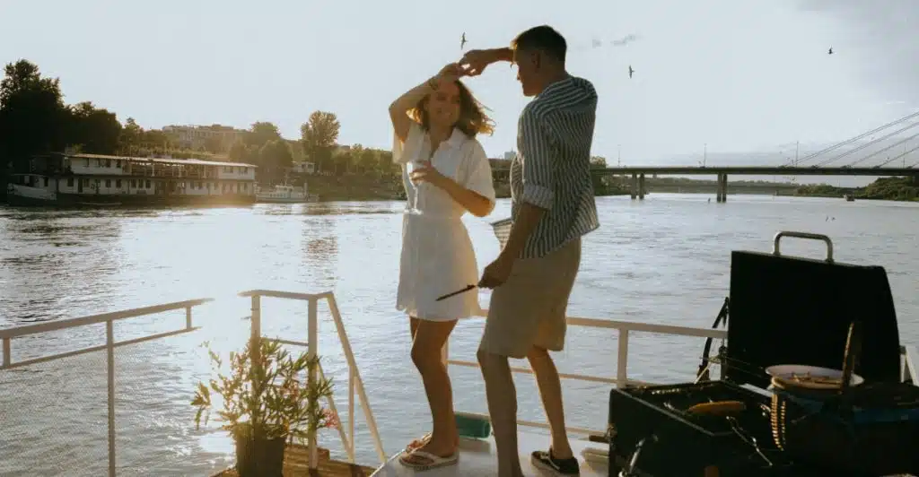 A Couple Dancing On a Boat at Sunset.