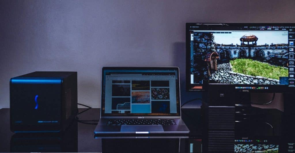 A laptop and computer setup, suggesting the use of streaming devices.