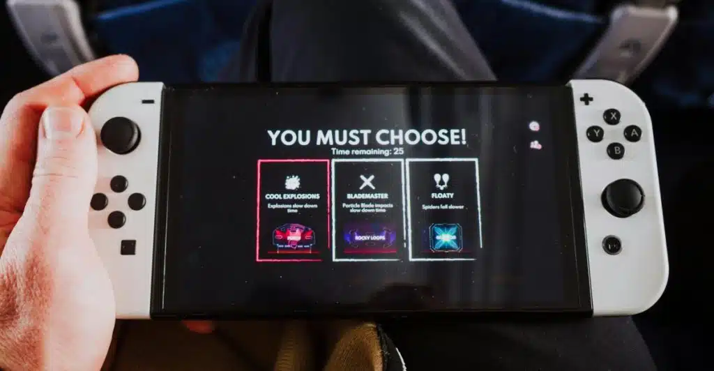 A person holding a white Nintendo Switch console displaying a game screen with a selection menu.