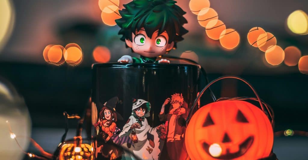 A figurine of the character Izuku Midoriya in a Halloween-themed setting.