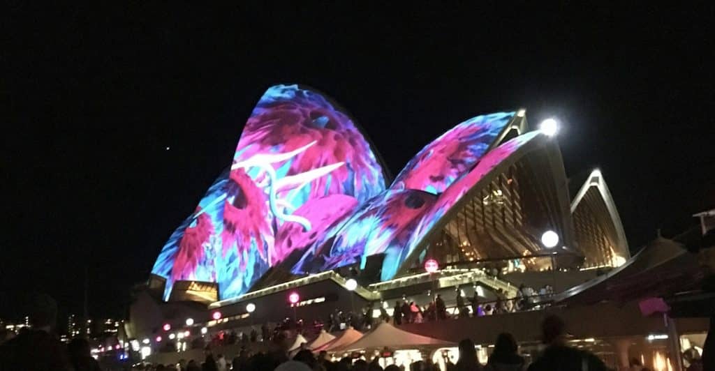 The Sydney Opera House illuminated with colorful projections during Vivid Sydney.