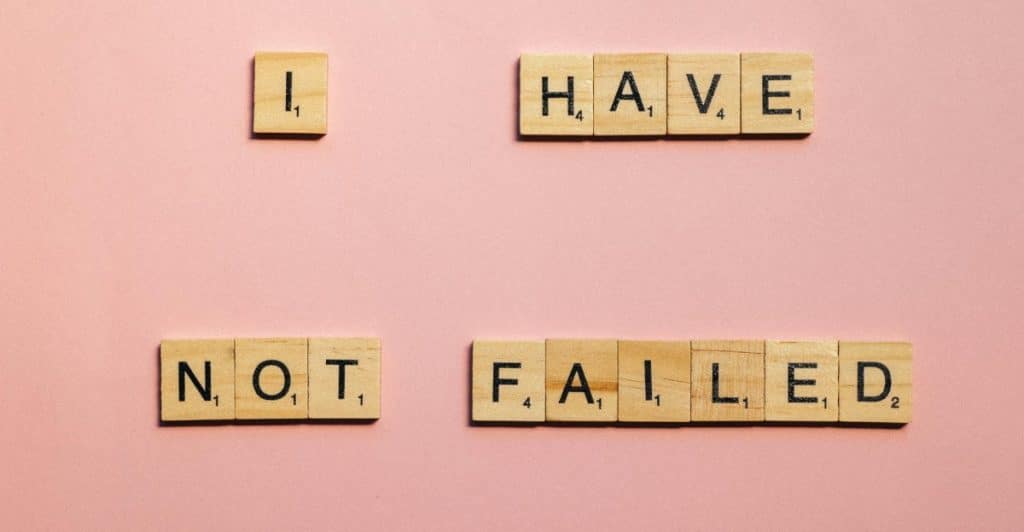 Wooden Scribble Cubes Spelling the Words "I HAVE NOT FAILED