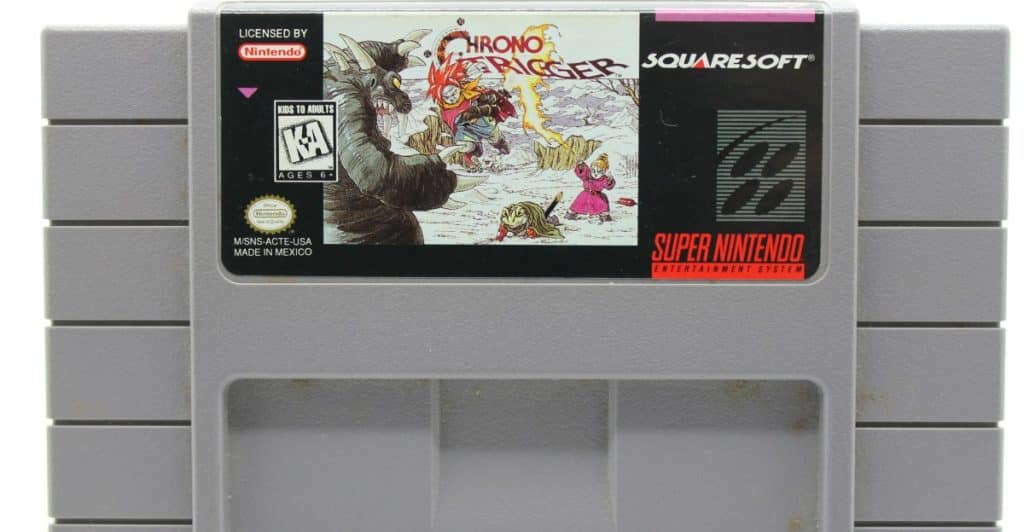 A Super Nintendo Entertainment System cartridge for the game Chrono Trigger, featuring characters from the game on the label.