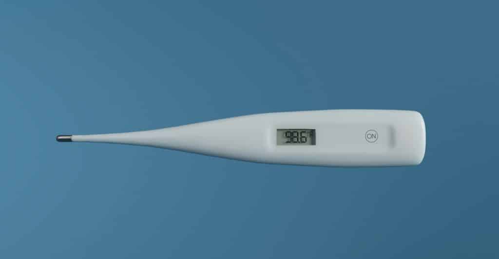 Digital thermometer showing a temperature of 98.6.