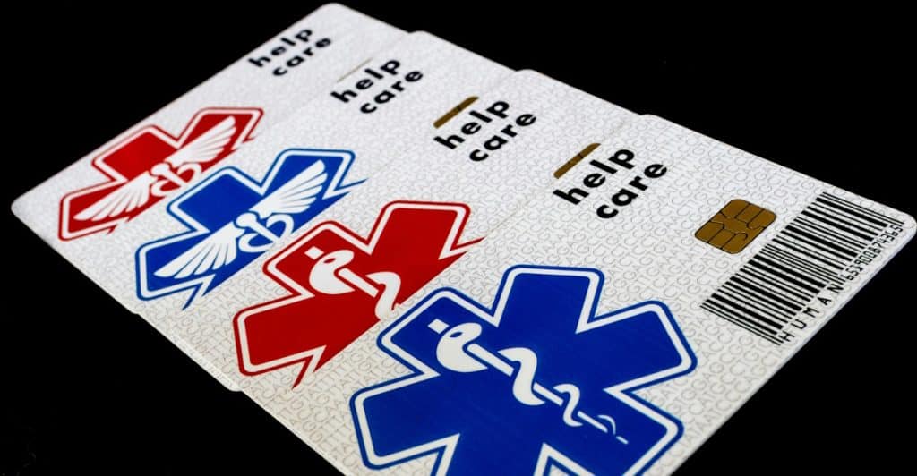 Multiple cards with emergency medical symbols and "help care" text.