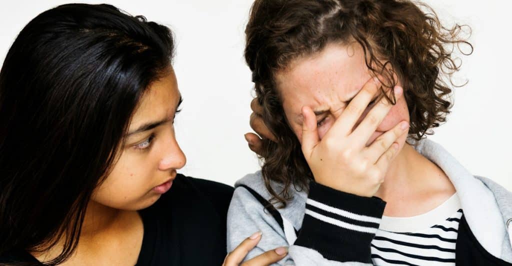 A woman showing concern for her female friend.