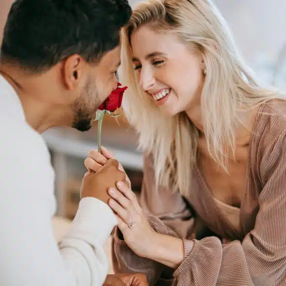A happy couple connecting deeply through a quiet moment at home, highlighting the power of small gestures.