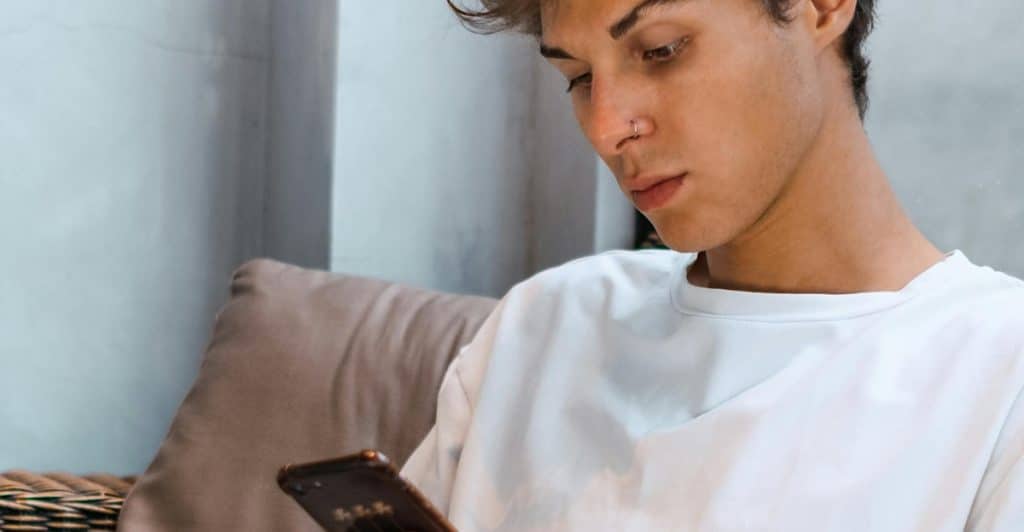 A man disabling phone notifications, choosing peace and presence over digital chaos.