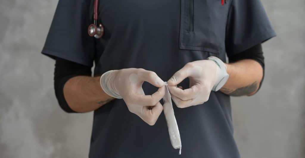 Rolled gauze and a roll of adhesive tape on a white background.