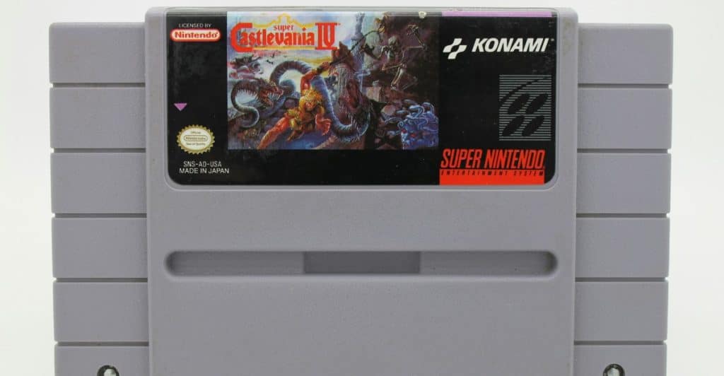A Super Nintendo Entertainment System cartridge for the game Super Castlevania IV, depicting Simon Belmont battling a creature on the label.