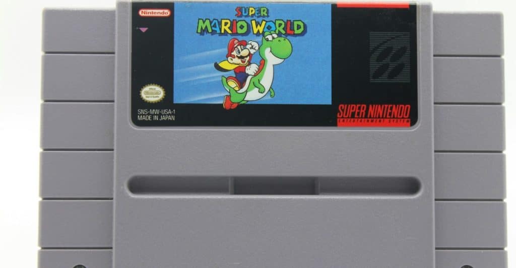 A Super Nintendo Entertainment System cartridge for the game Super Mario World, featuring Mario and Yoshi on the label.