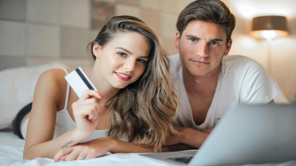 A couple looking at online shopping together with relaxed expressions.