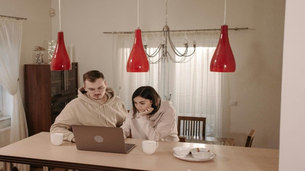A couple reviewing emergency financial plans together at home.