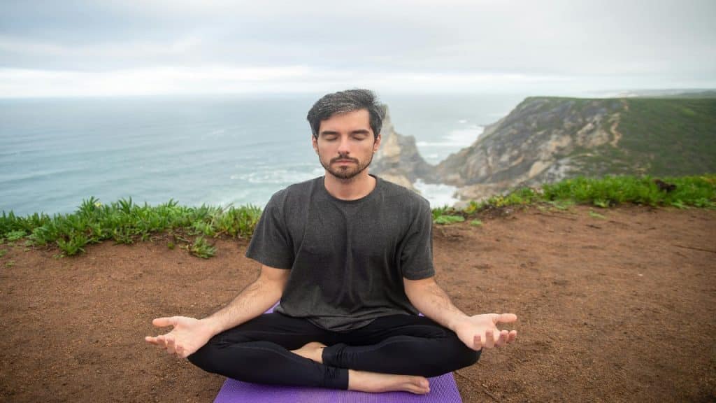 Man meditating and taking a mental break from dating to reset emotionally