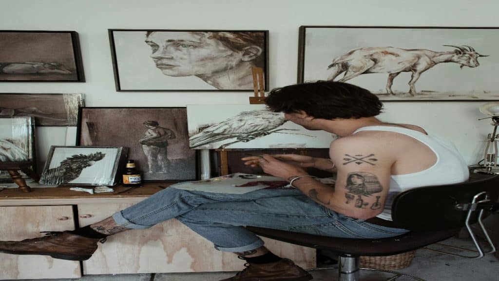 A man painting on a hobby alone.