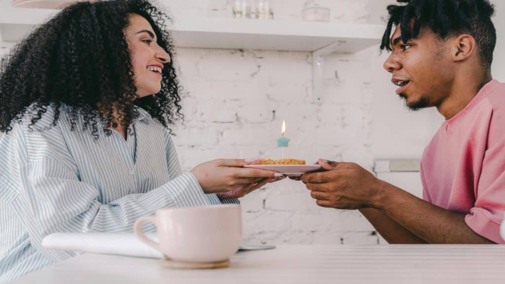 A relaxed date scene where both people are laughing.