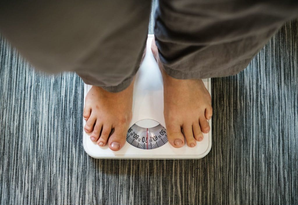A man checking his weight