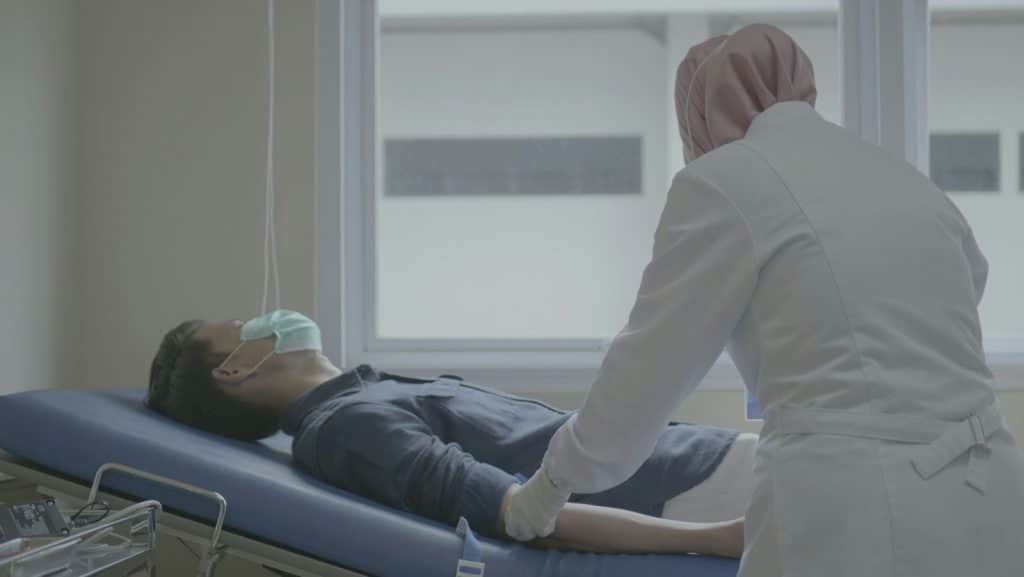 Man lying on an hospital bed