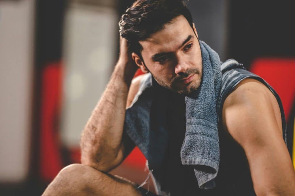 An attractive man posing at the gym
