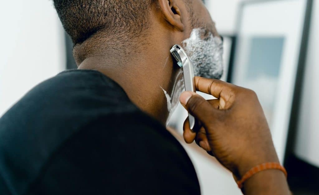 A man shaving his beard