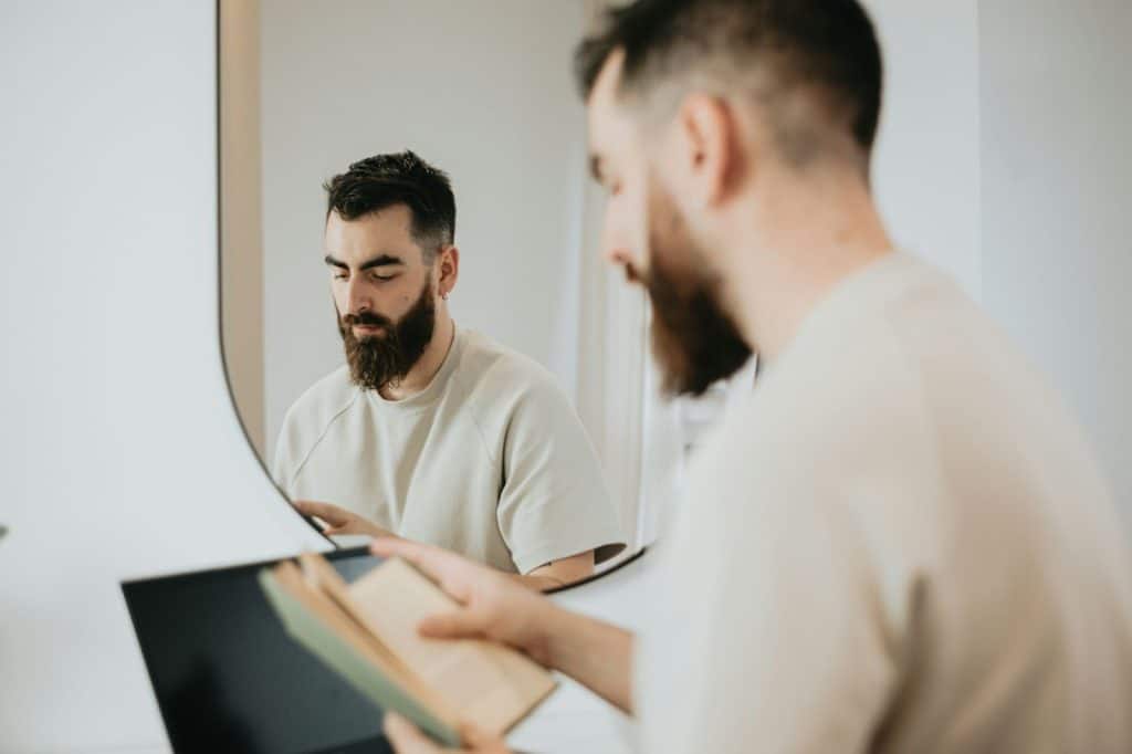 Man holding a notebook for taking notes