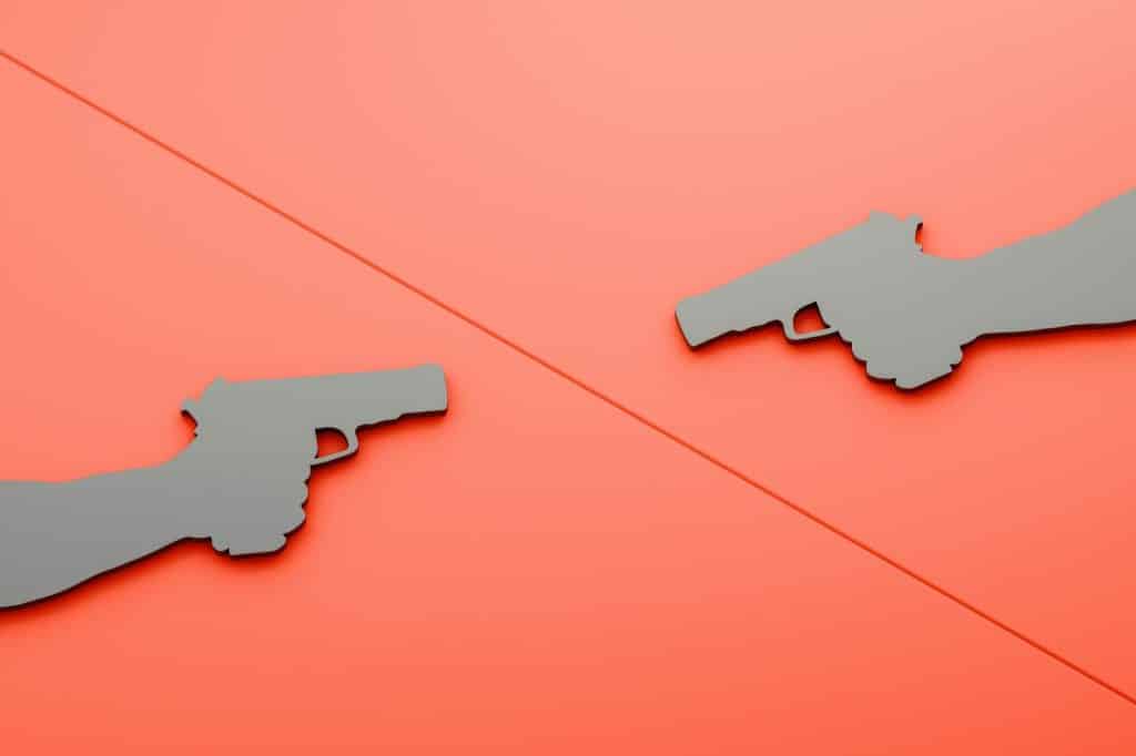 Two hands holding a gun.