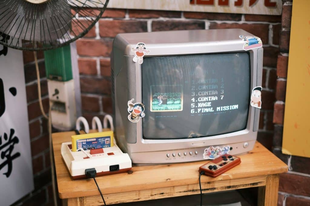 A Vintage T.V. that shows the game of contra.