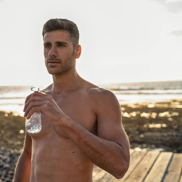 A man holding a water bottle