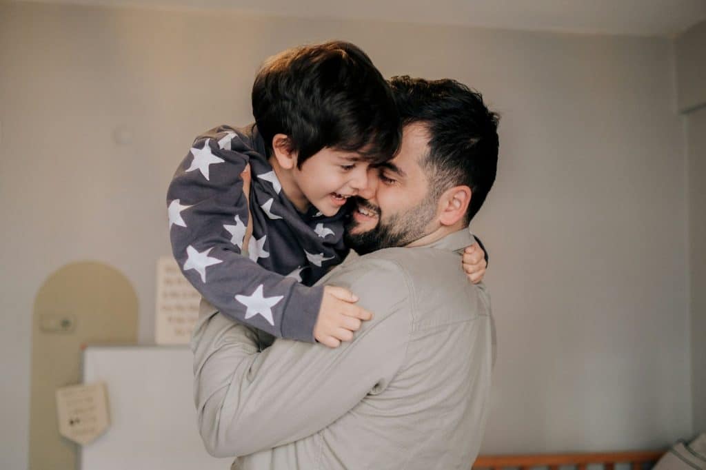 A Father holding his son