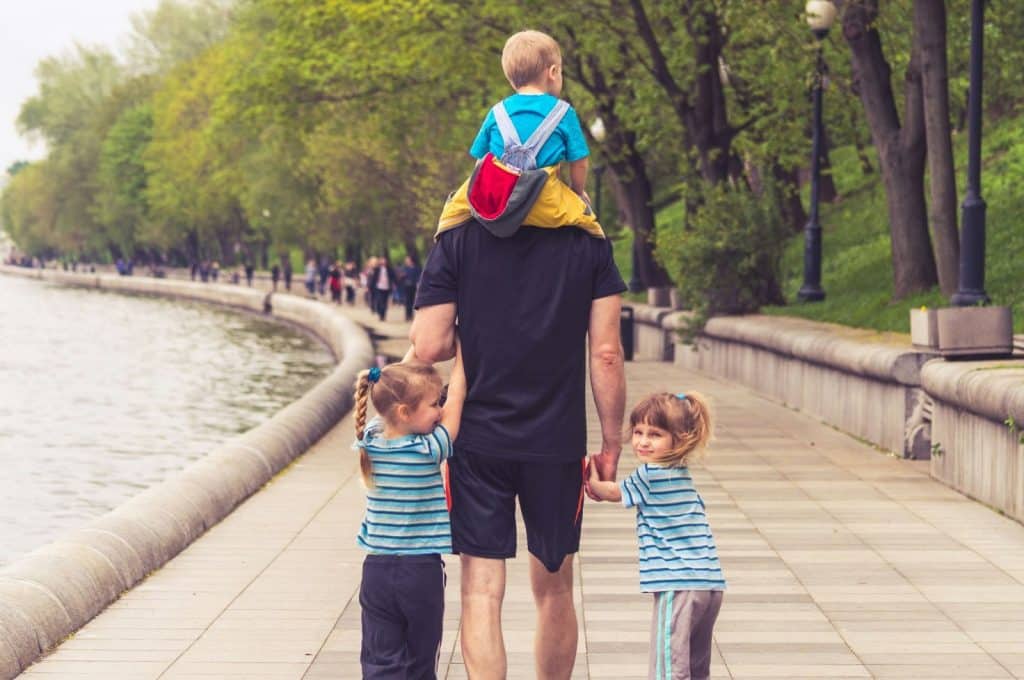 Father walking with his children