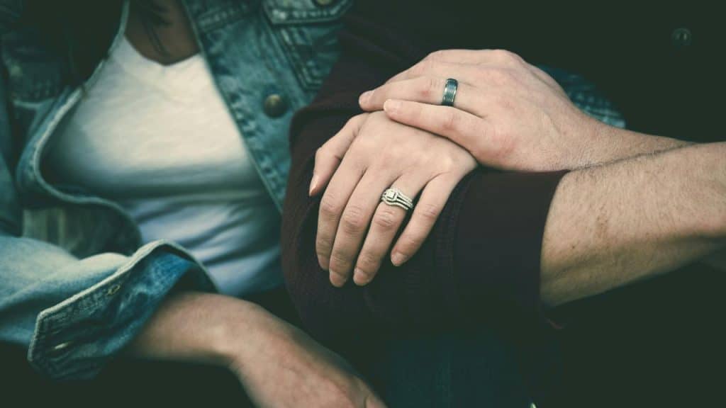 A partner offering a helping hand to help normalize emotional struggles.