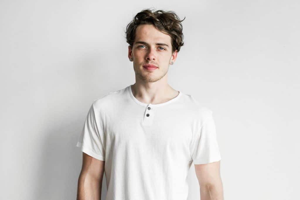 Attractive man wearing henley shirts.
