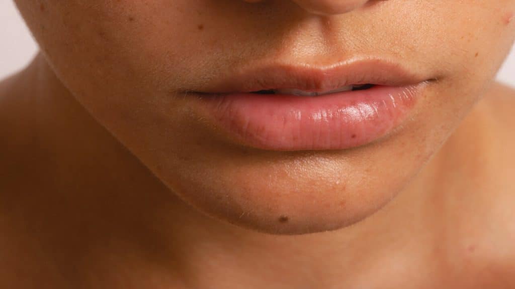 Close up of a person’s lips.