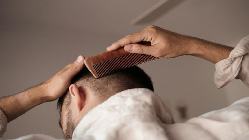 A man combing his hair.