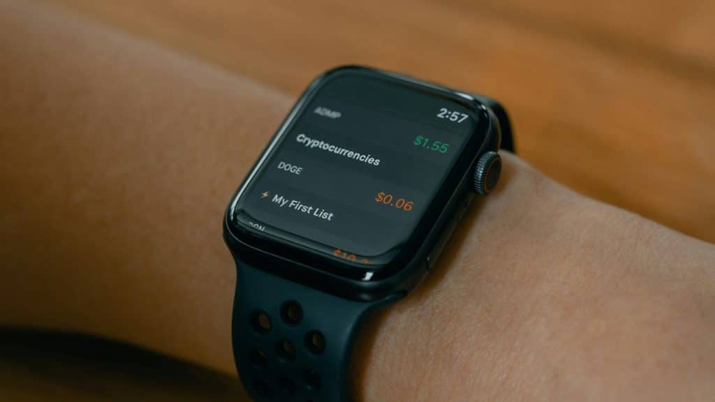 A close-up of an Apple Watch on a wrist, displaying a list.