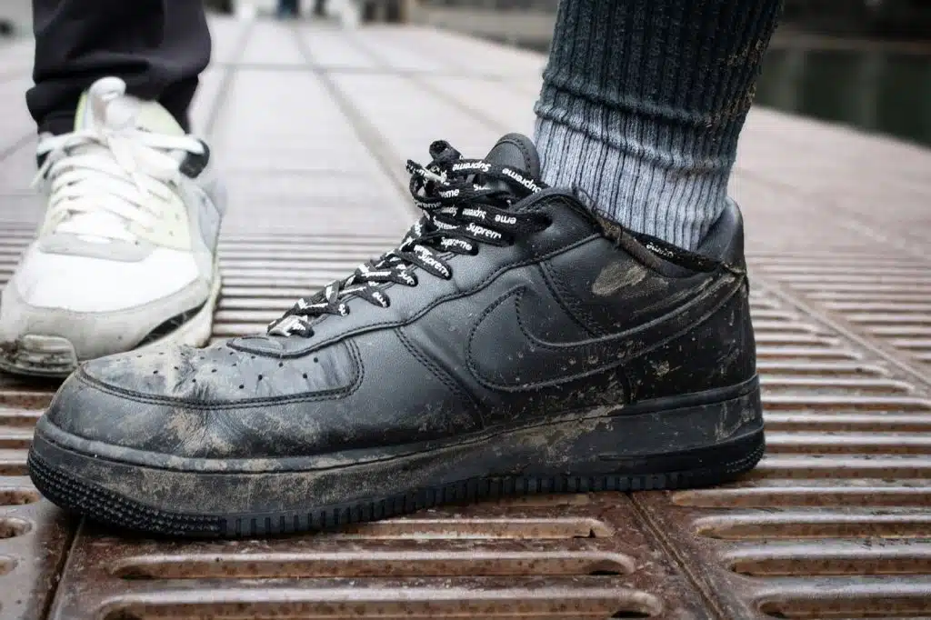 A man wearing dirty shoes.