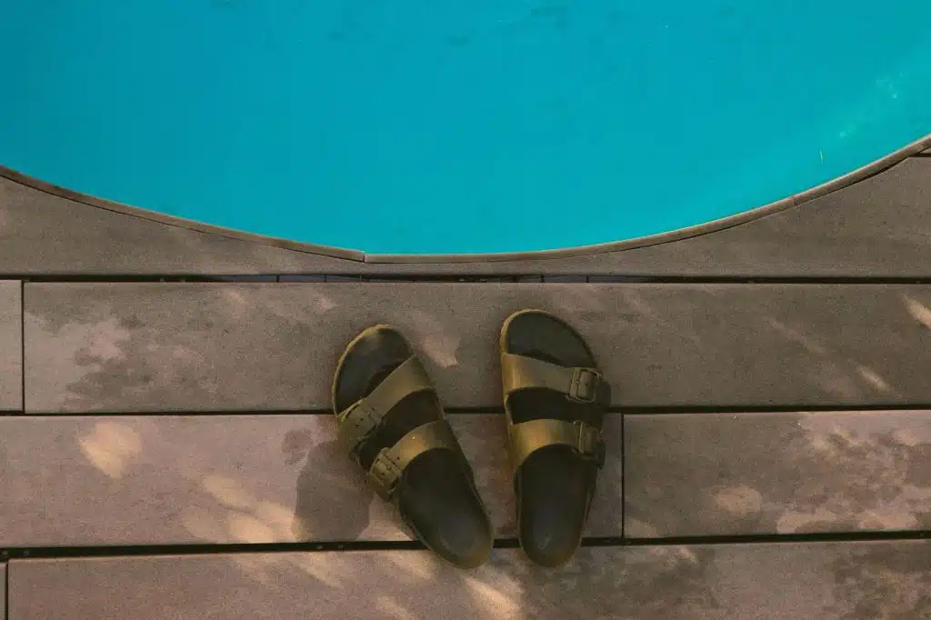 A picture of a slides beside the pool.