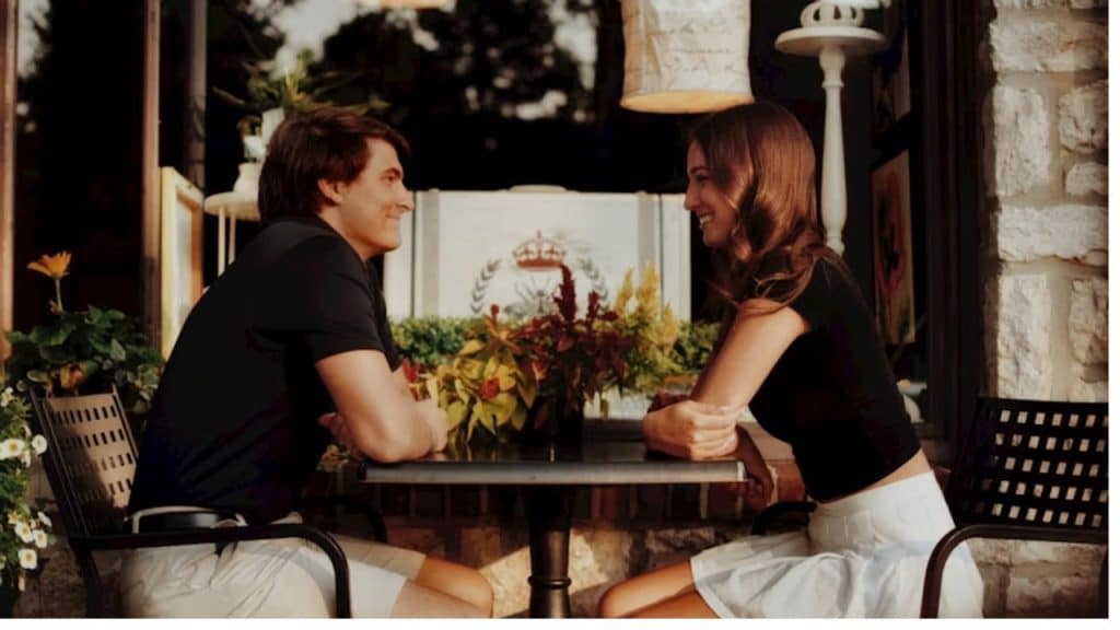 Man and woman connecting over coffee, focused on shared values during a date.