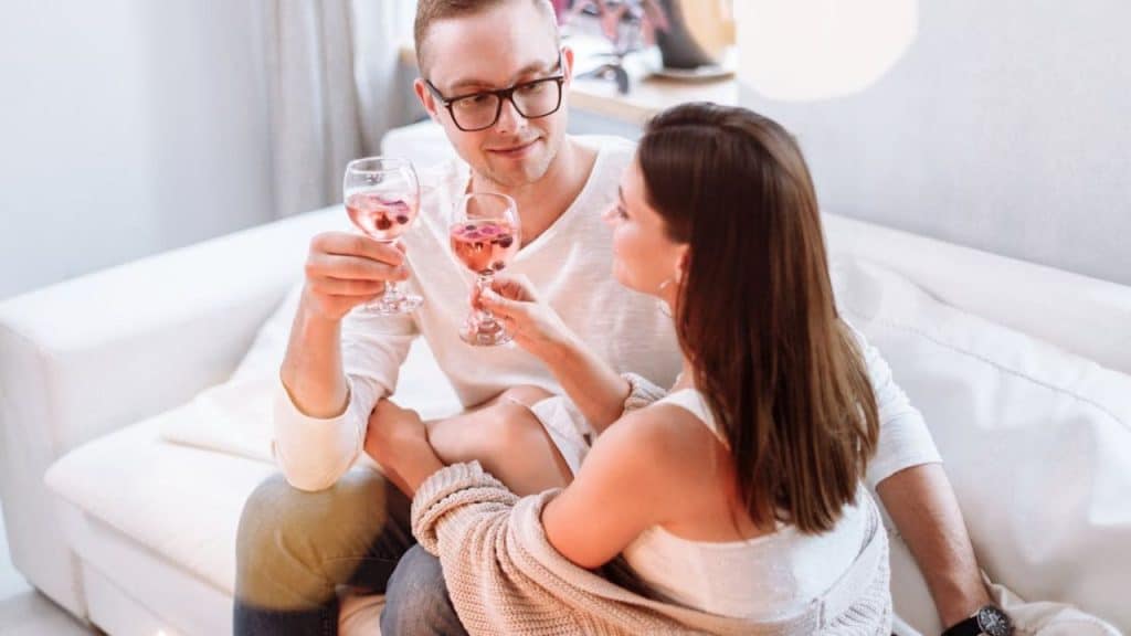 Couple sharing a quiet moment of emotional trust and intimacy at home.