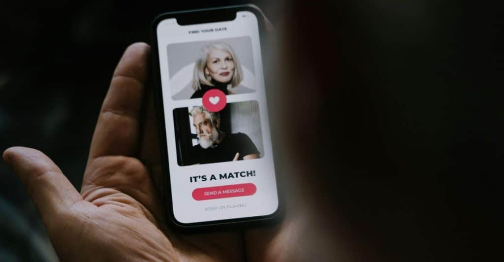Smartphone with dating app representing swipe fatigue