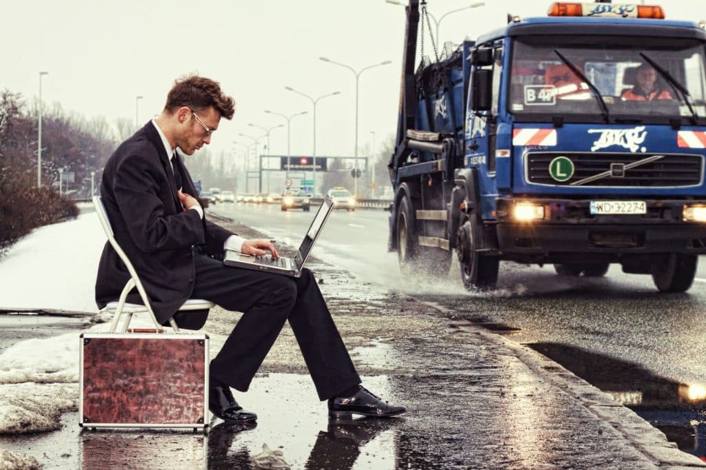 A man that is busy with his laptop