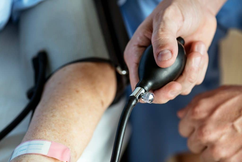 An arm of a person getting check for a high blood pressure